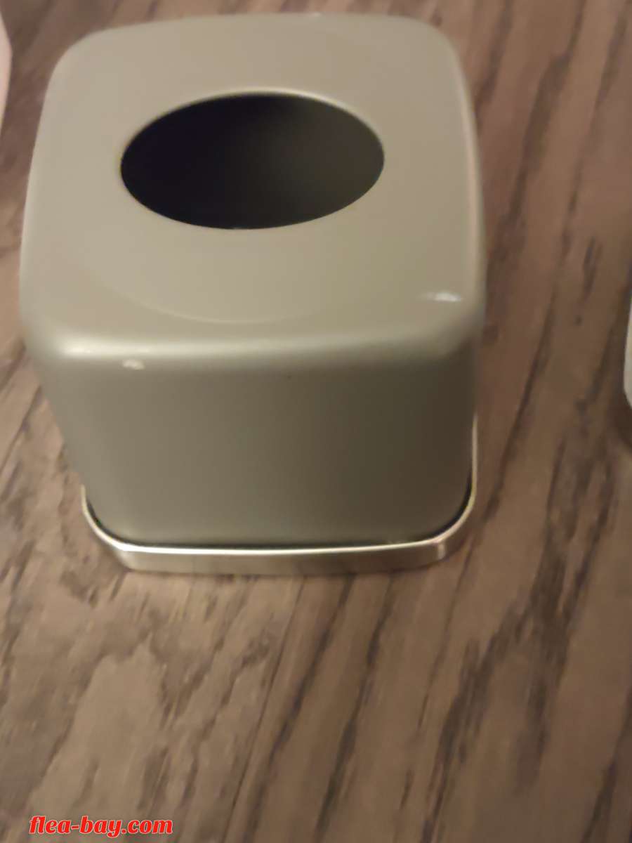 grey and chrome metal tissue box cover