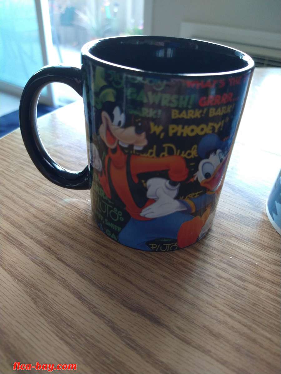two Disney coffee cups