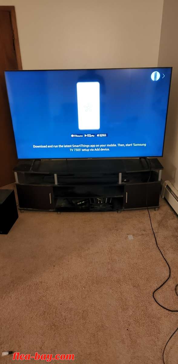 75in tv with entertainment center and soundbar with subwoofe
