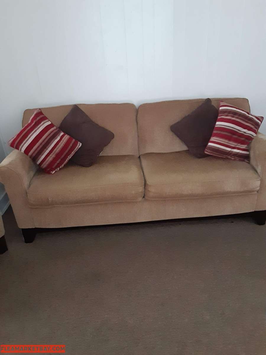 Tan colored sofa & chair set w/ throw pillows