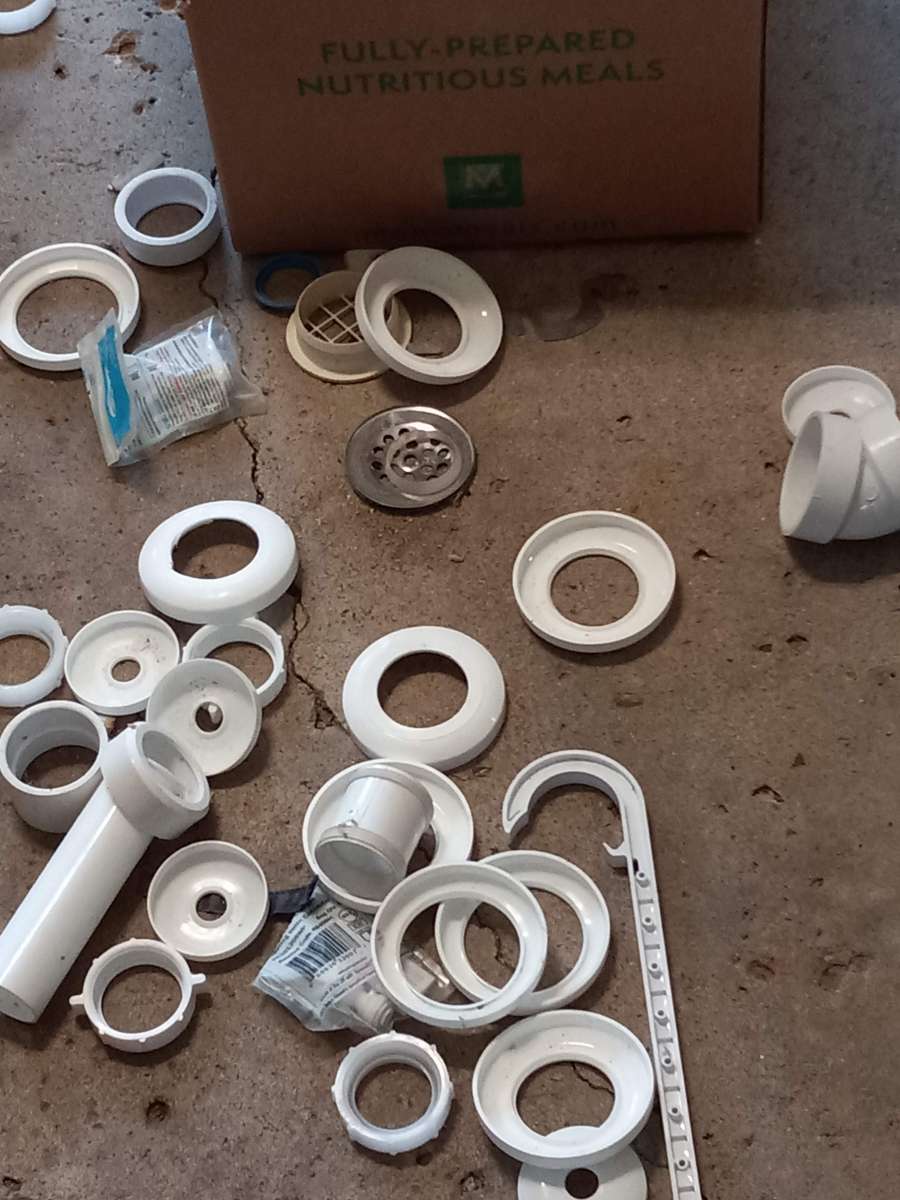 lots of home plumbing parts elbows and drains and couplings