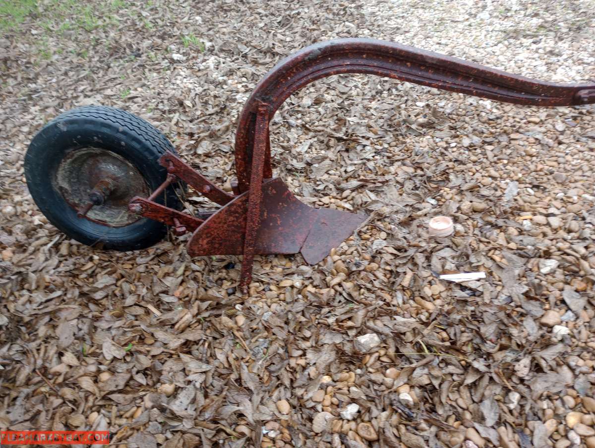 old pull behind plow
