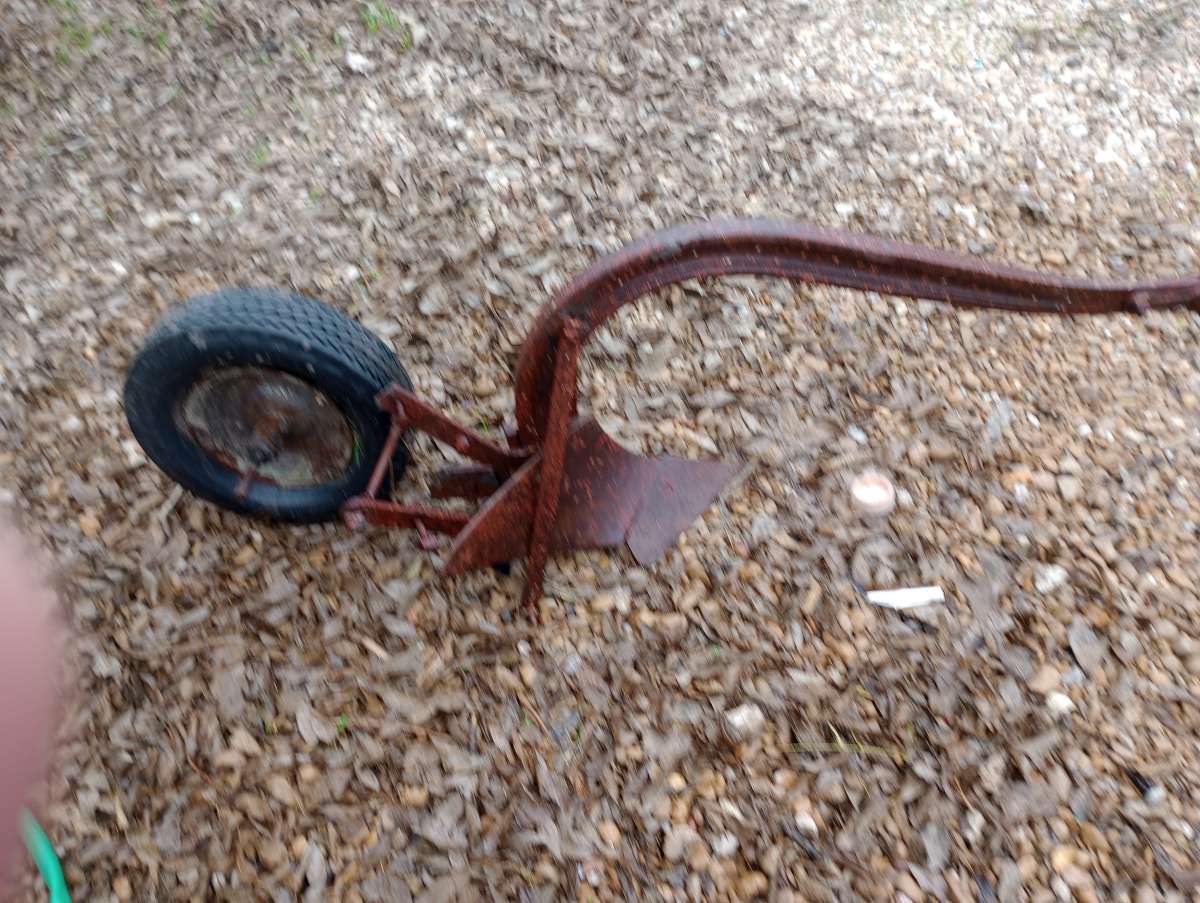 old pull behind plow