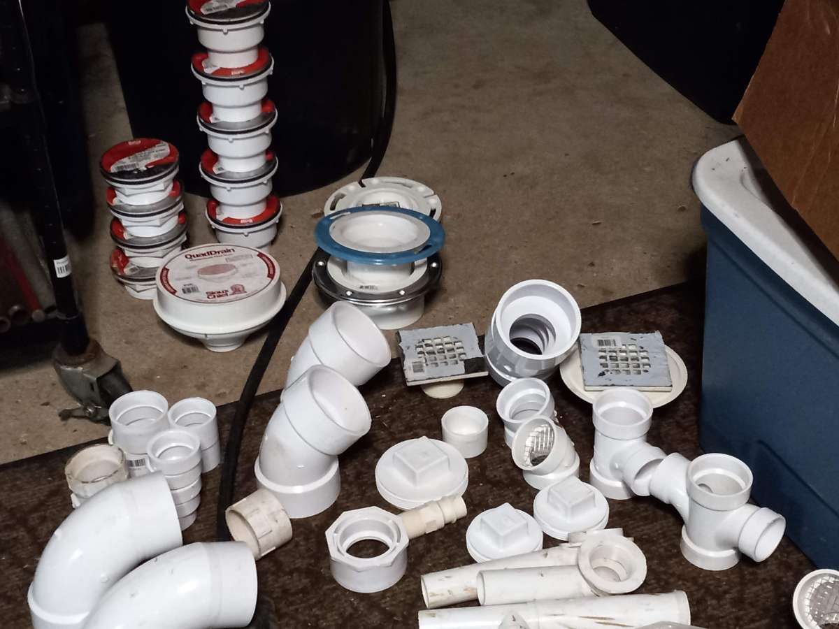 lots of home plumbing parts elbows and drains and couplings