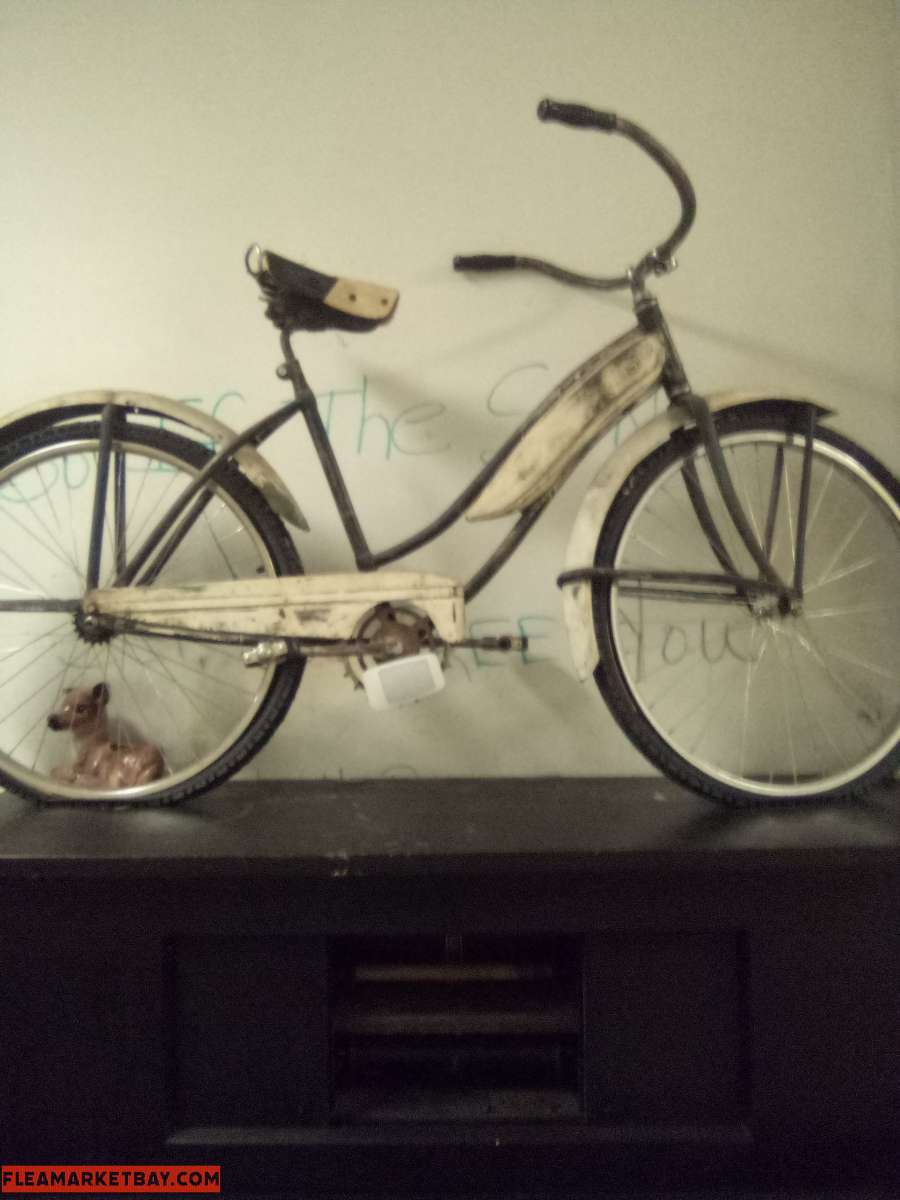 white vintage chrome bycicle with white wall tires