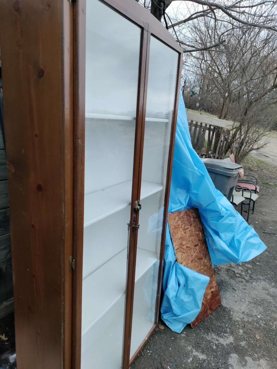 two very tall vanities or display cases