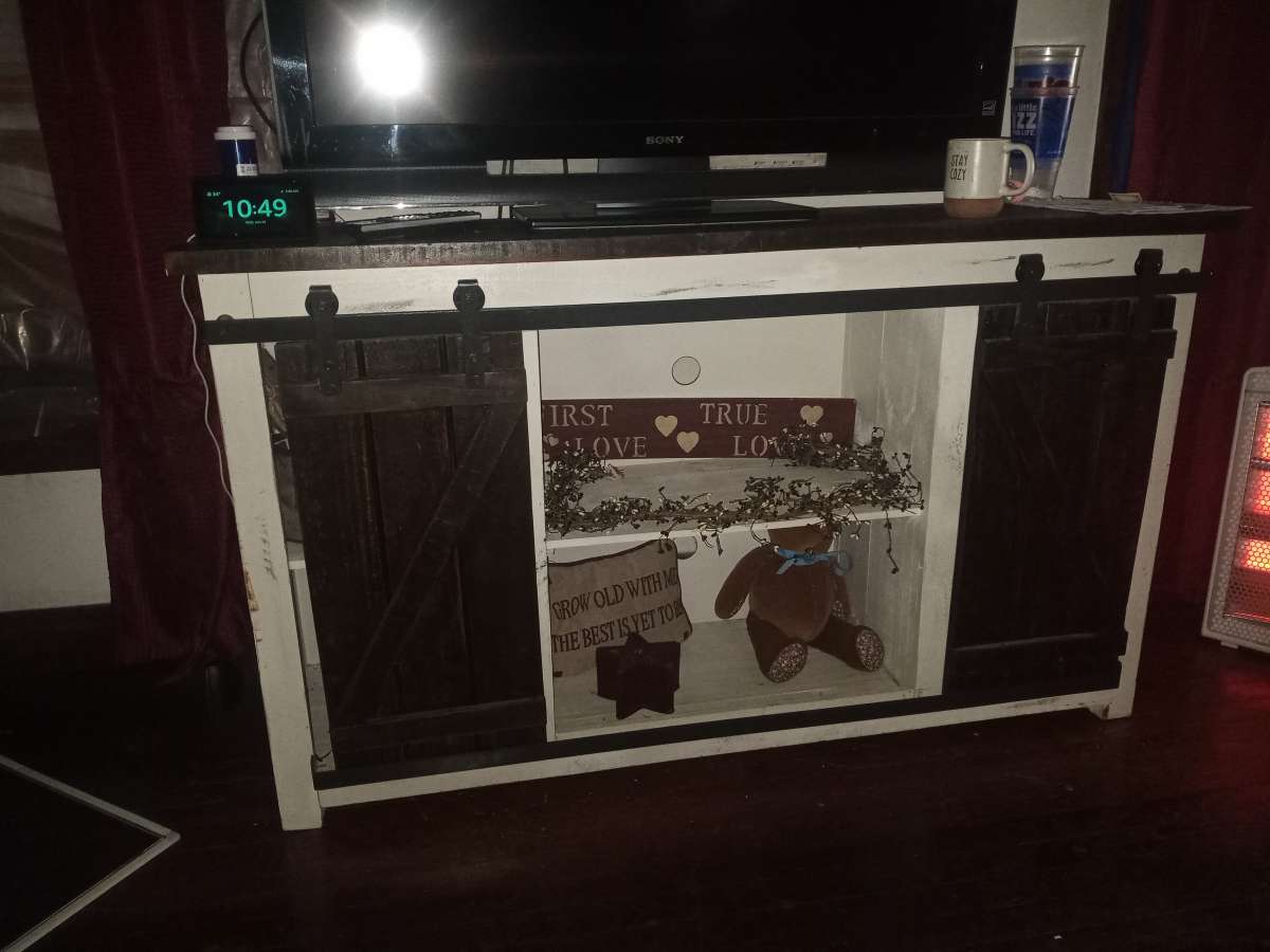 white washed barn door entertainment stand