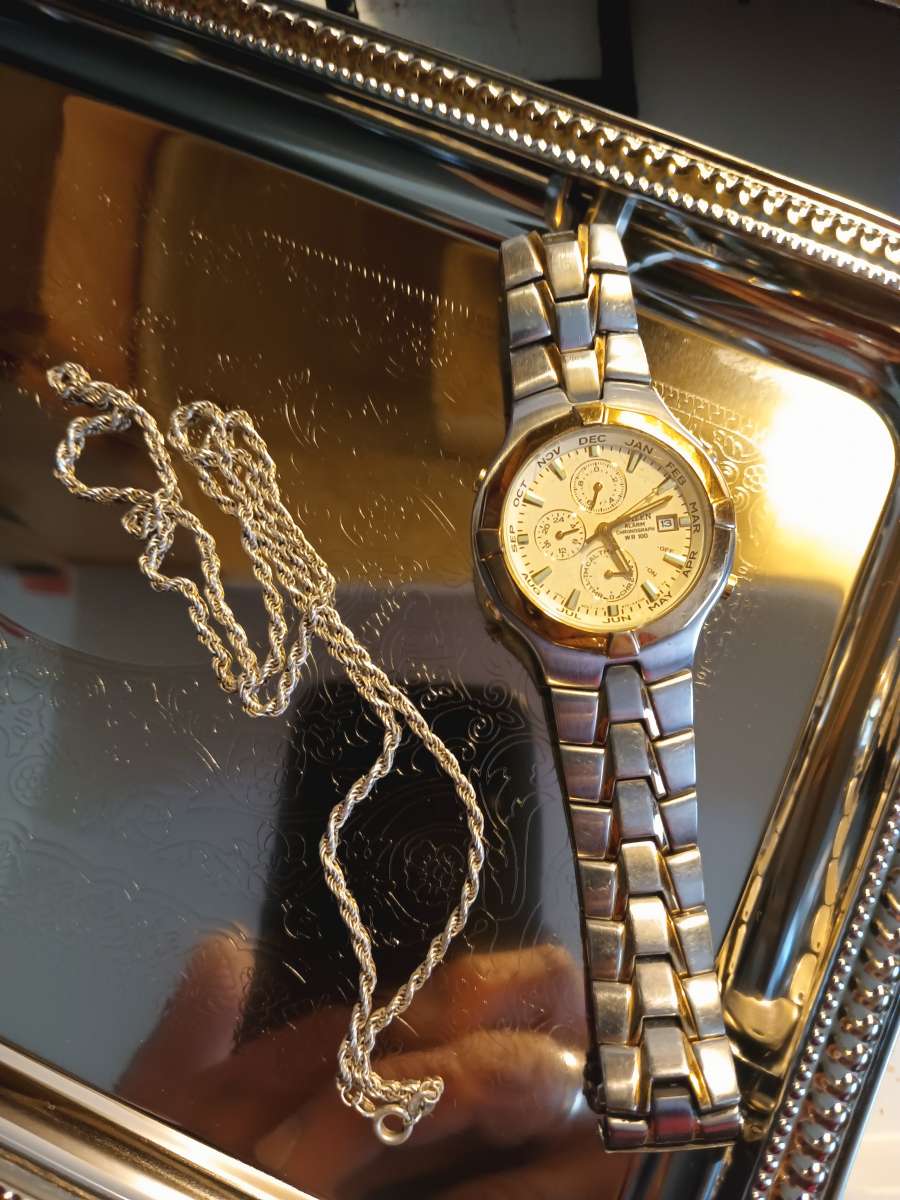 silver necklace and watch