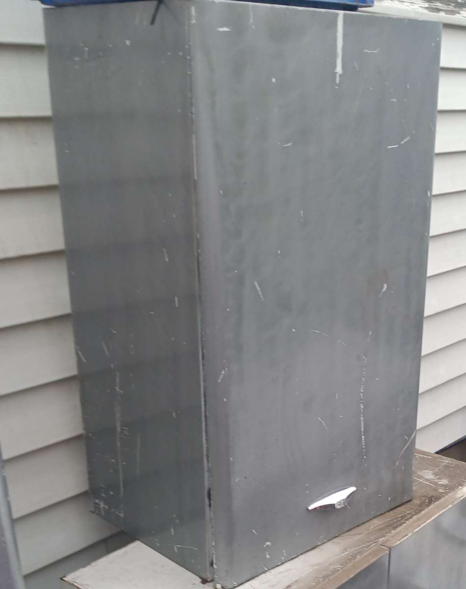 single door metal cabinet with built in shelf