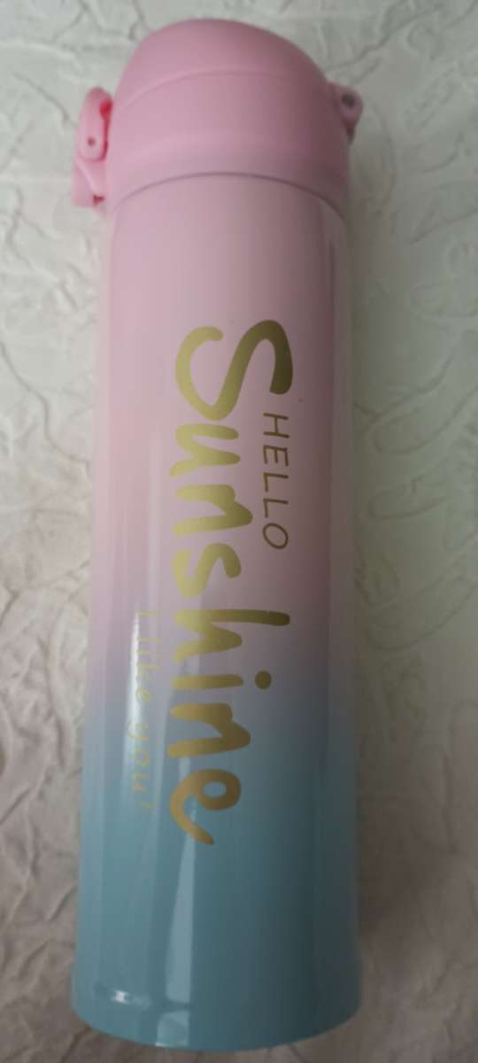 A steel drinking cup thermos