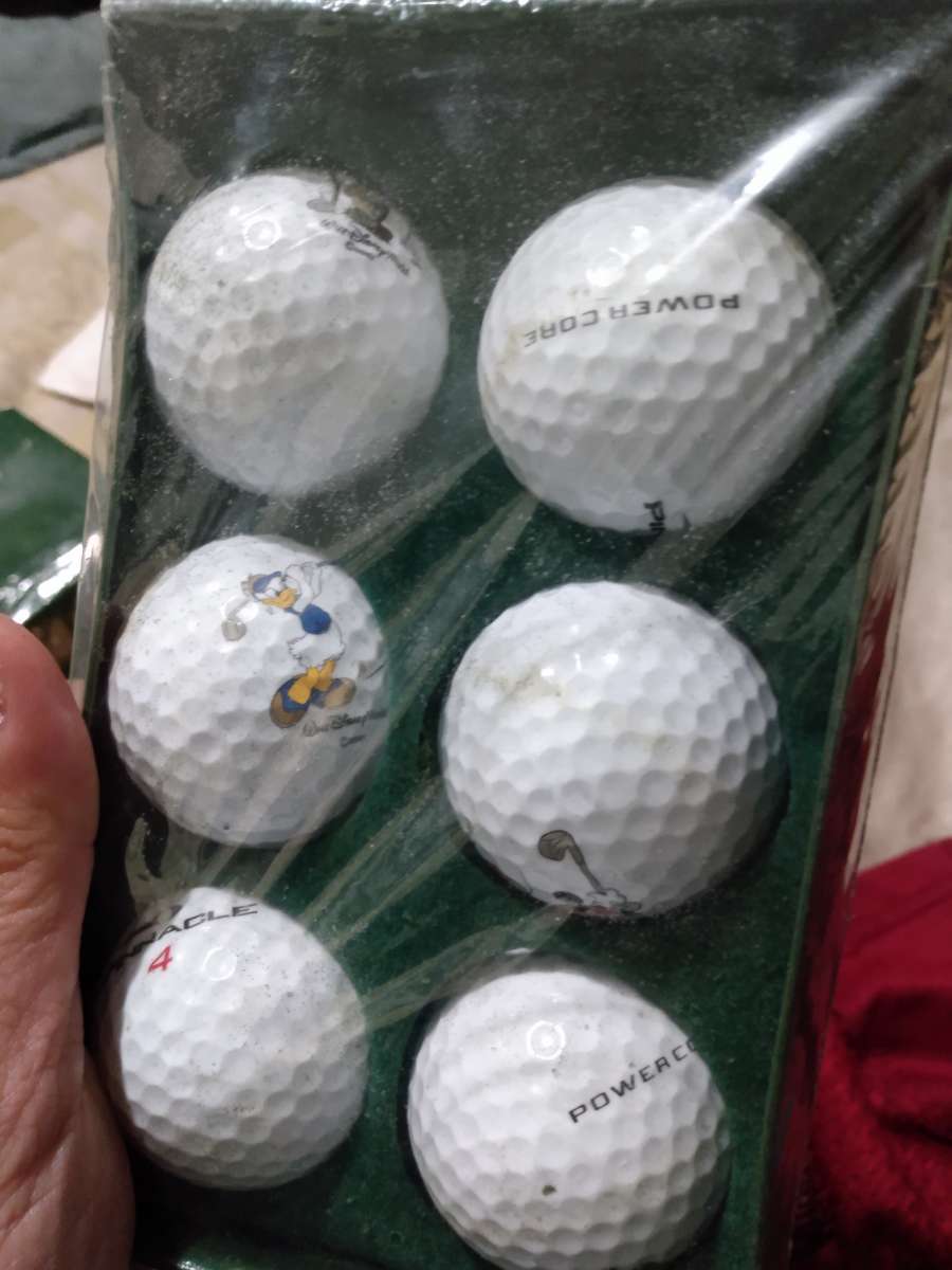 golf balls with mickey and goofy and Donald disney collectio