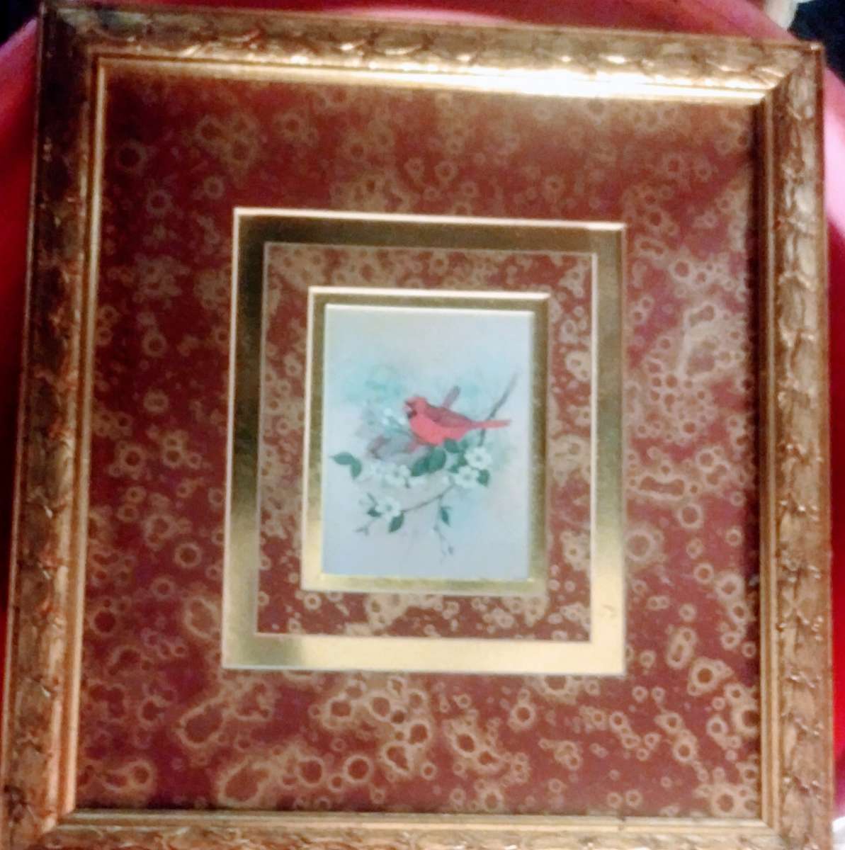 GOLD FRAME WITH PICTURE OF A GARDNAL