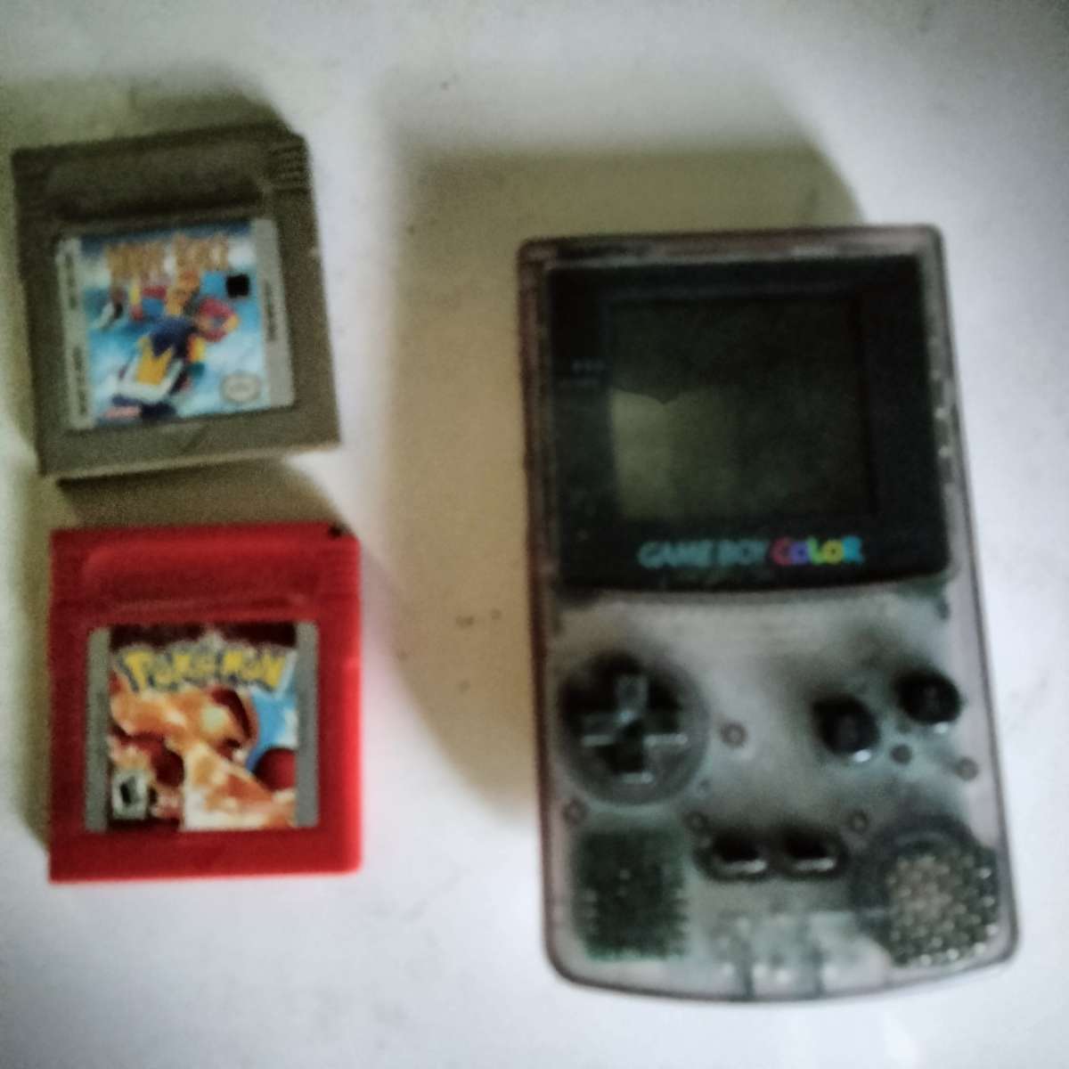 game boy color with 2 games