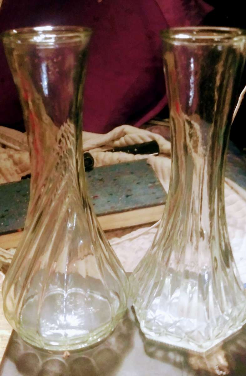 Two medium clear vase