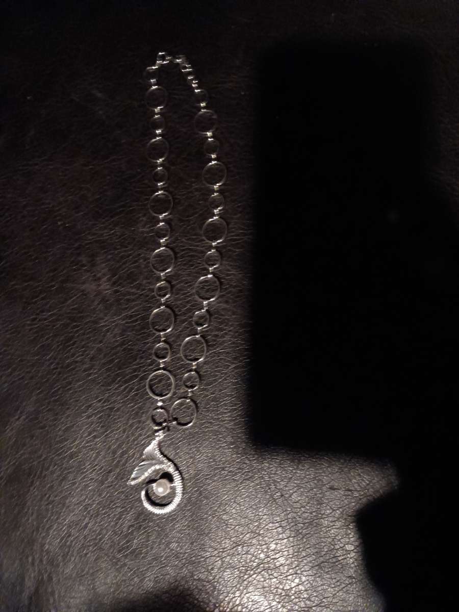 silver with a pendant and pear