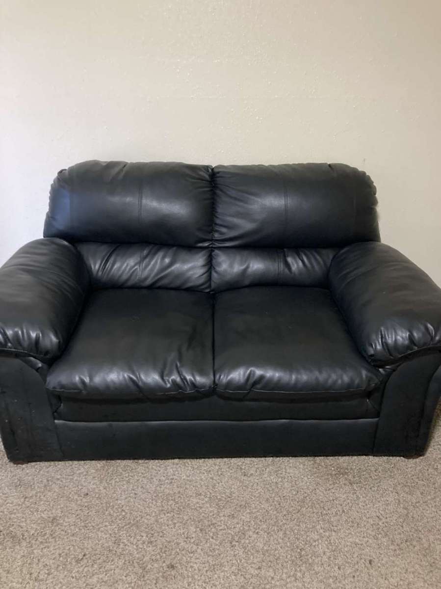 black leather couch w ottaman