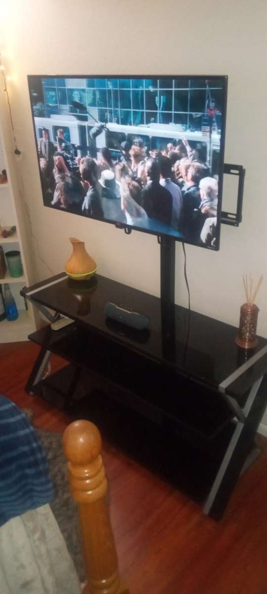 45 inch TV with glass stand with mount built in