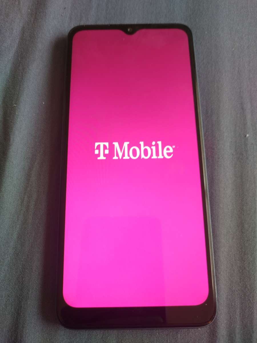 TMobile revvl 6 5G cellphone with charger cord and protector