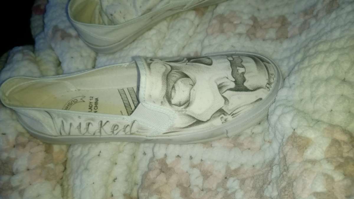 shoes with prison art drawn on them by the homeboy Jhonny m