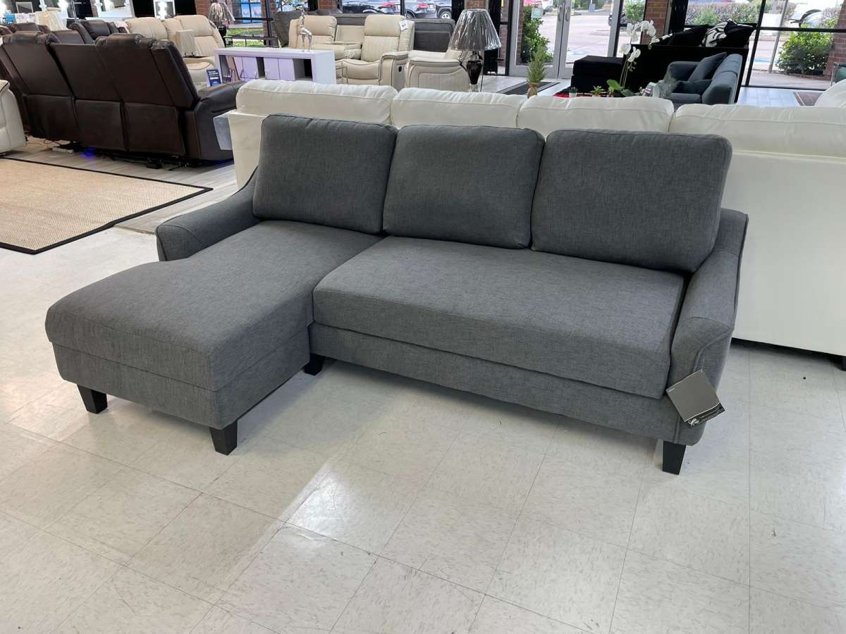 Jarreau aShley Sleeper Sectional in stock  grey on display