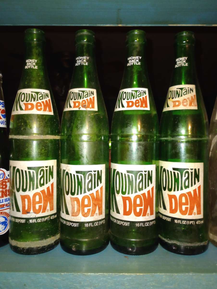 set of 4 mountain dew bottles