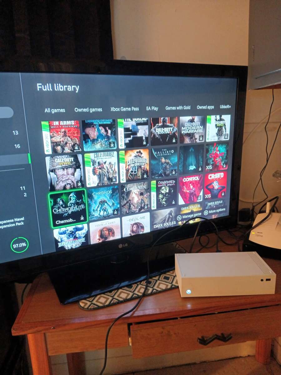 Xbox one with 300 games in it and 5 controllers