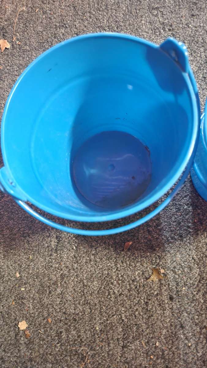 Small blue buckets perfect for pens on the desk