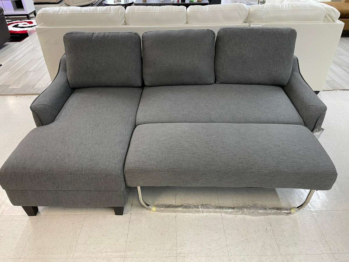 Jarreau aShley Sleeper Sectional in stock  grey on display
