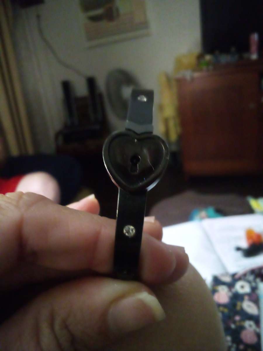 a black bracelet and a white Kate Spade bracelet