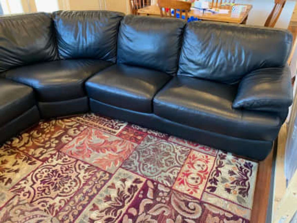 Black leather sofa with chaise