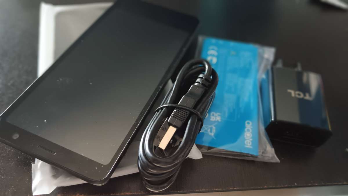 new black cell phone with charger