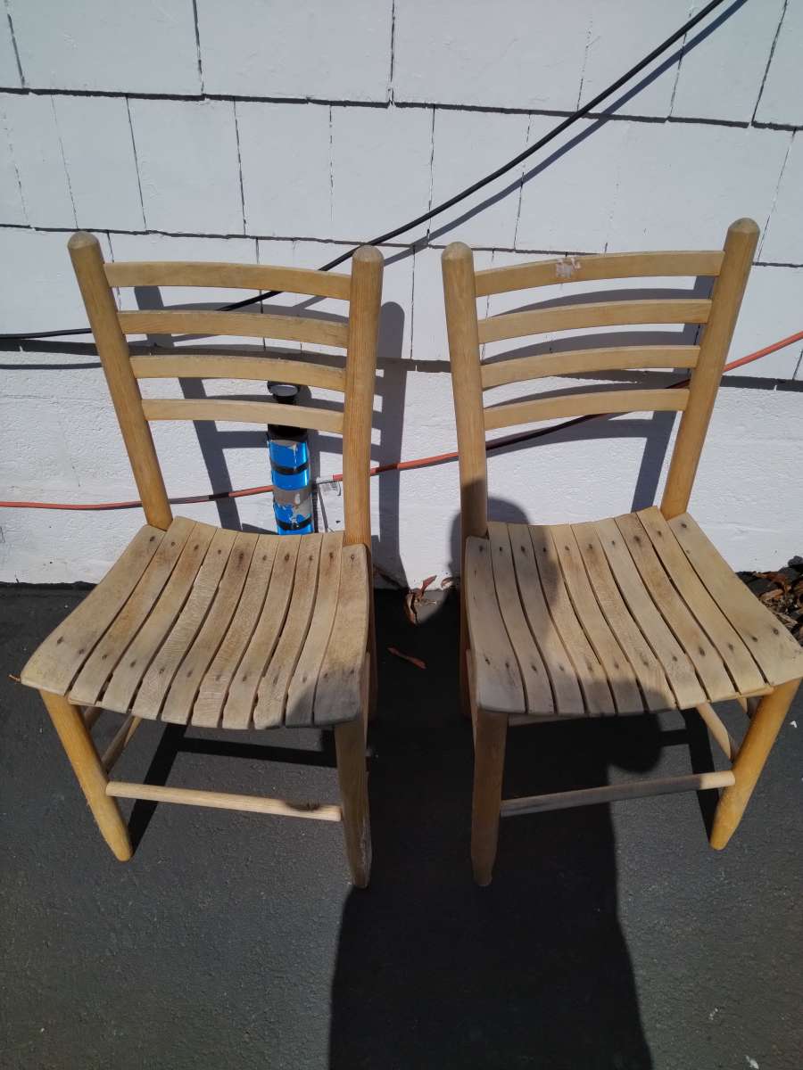 two wooden Pellegrin chairs and pieced for one