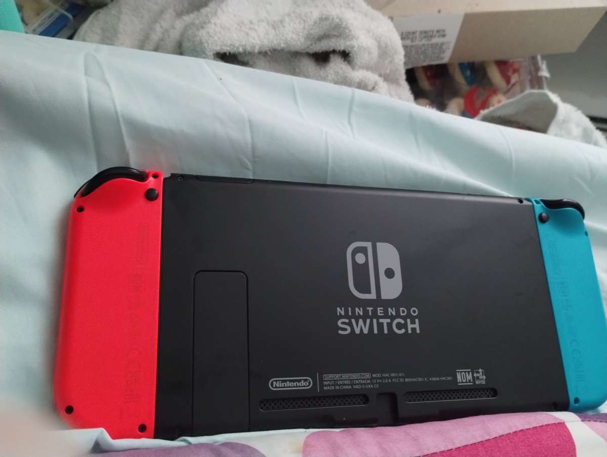 Nintendo switch neon red and blue and accessories