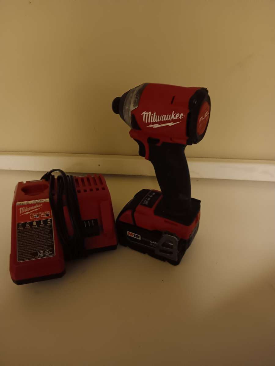 Milwaukee impact drill with battery and charger