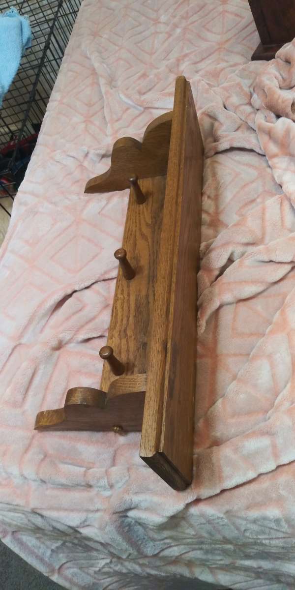 Brown shelf with knobs