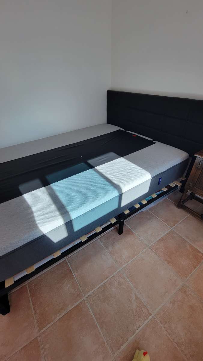 Queen memory foam mattress with a bed frame