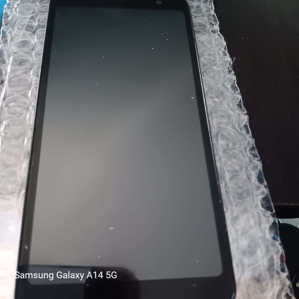 new black cell phone with charger