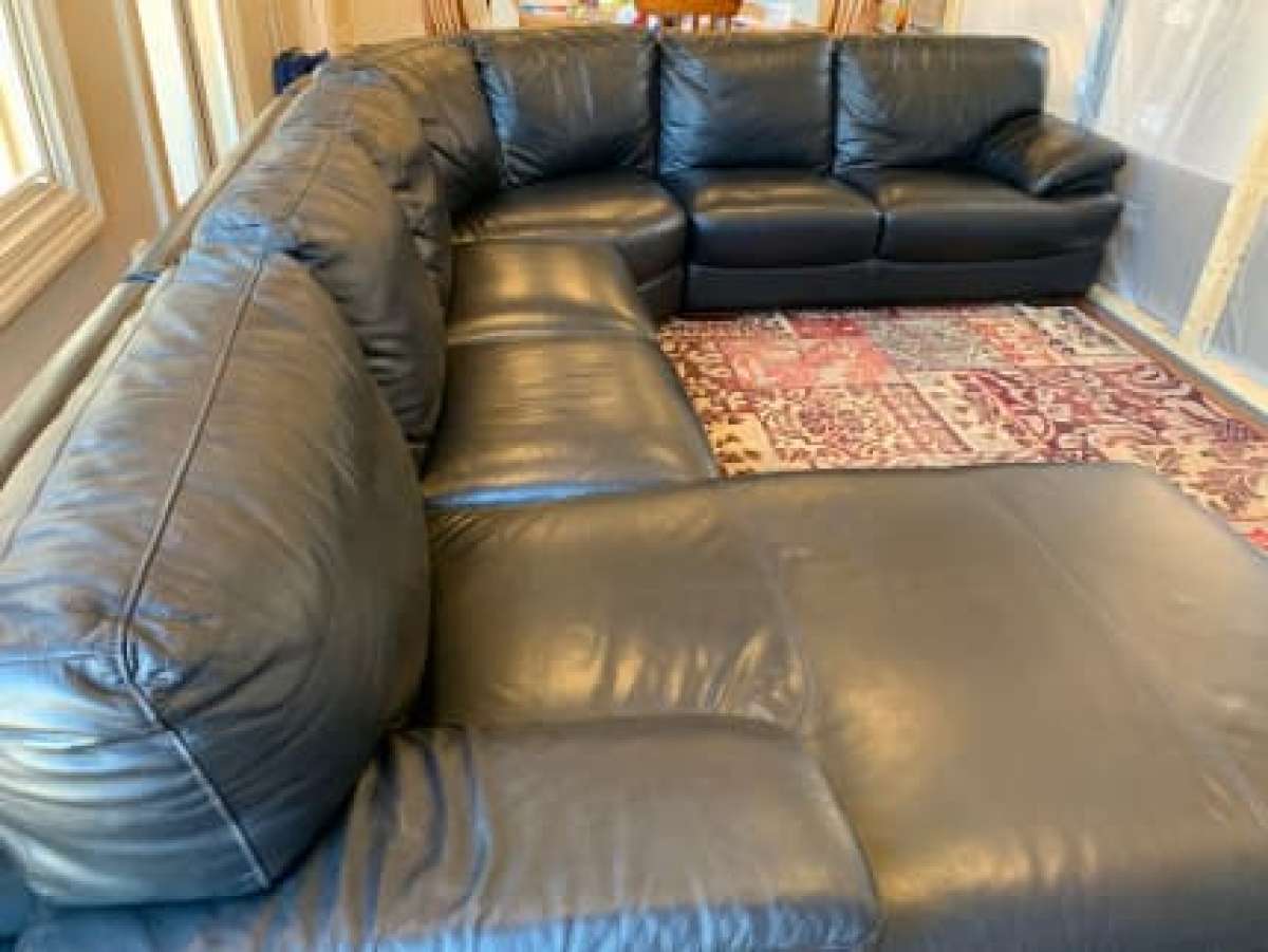 Black leather sofa with chaise