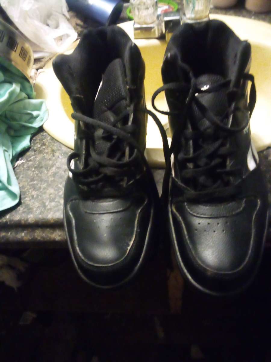 Black and white Reeboks High tops