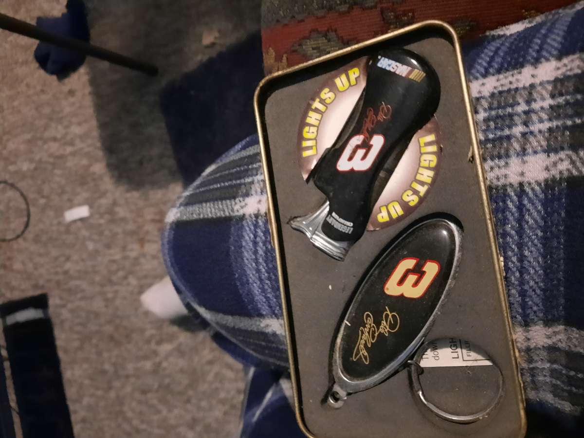 small tin box with Dale Earnhardt 7 time Winston cup champio