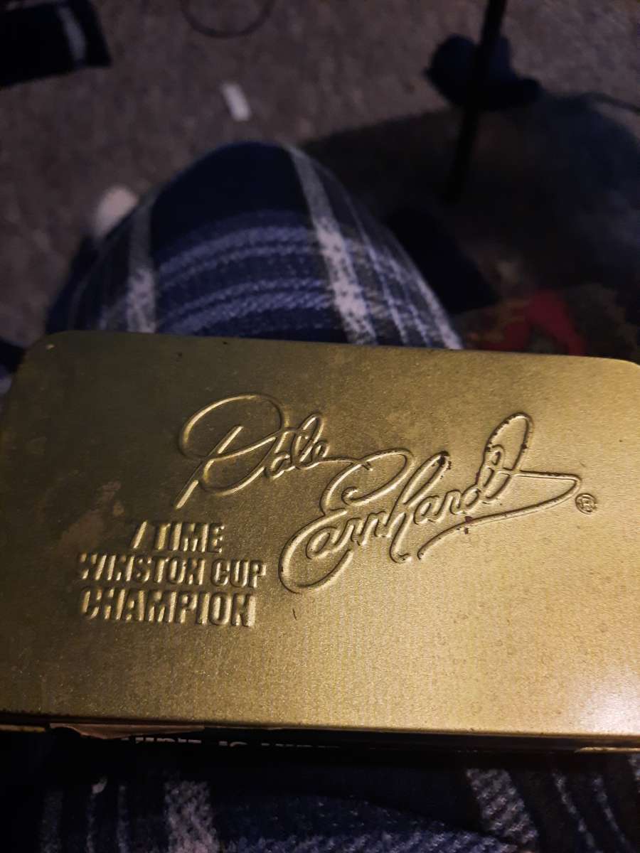 small tin box with Dale Earnhardt 7 time Winston cup champio
