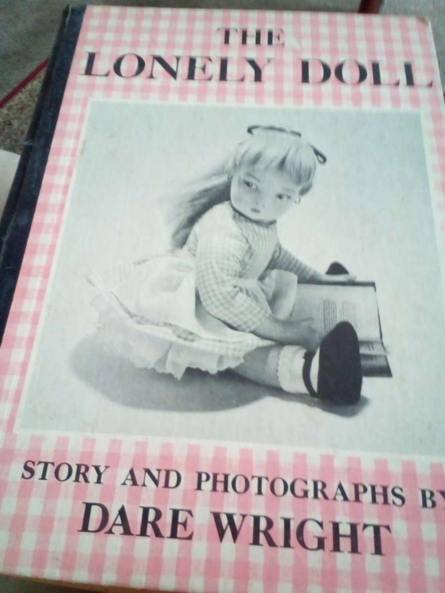 hard back book of the lonely doll story and photos by Dare w