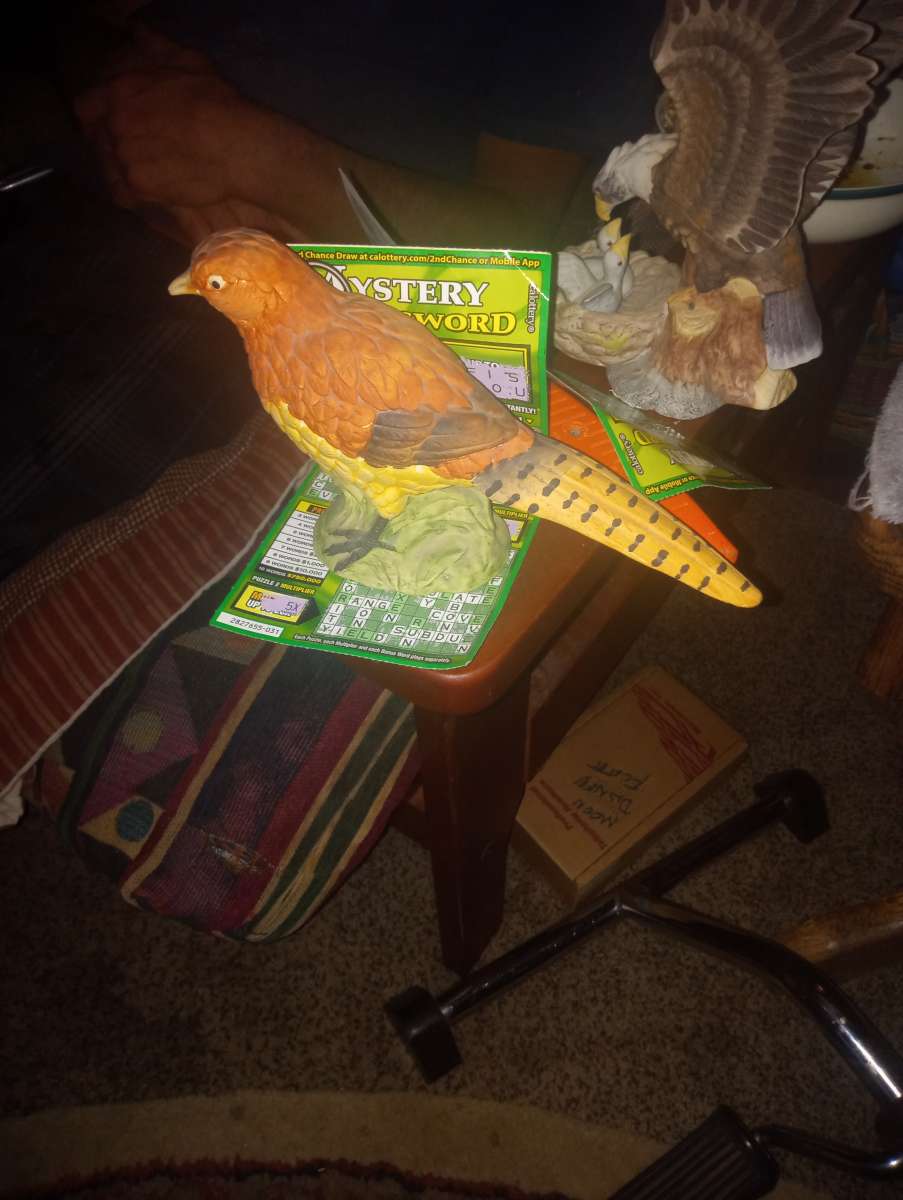 female pheasant statue