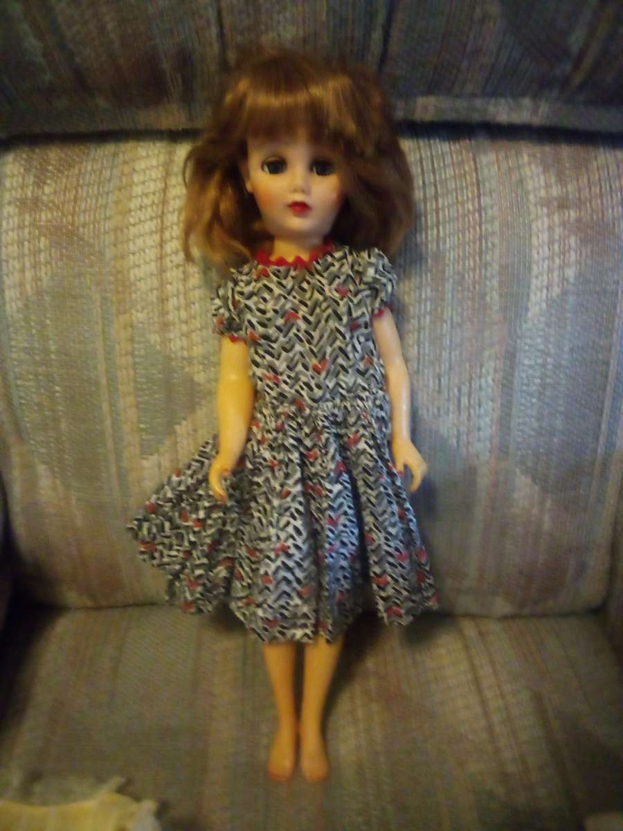 baby doll with lots of clothes and shoes