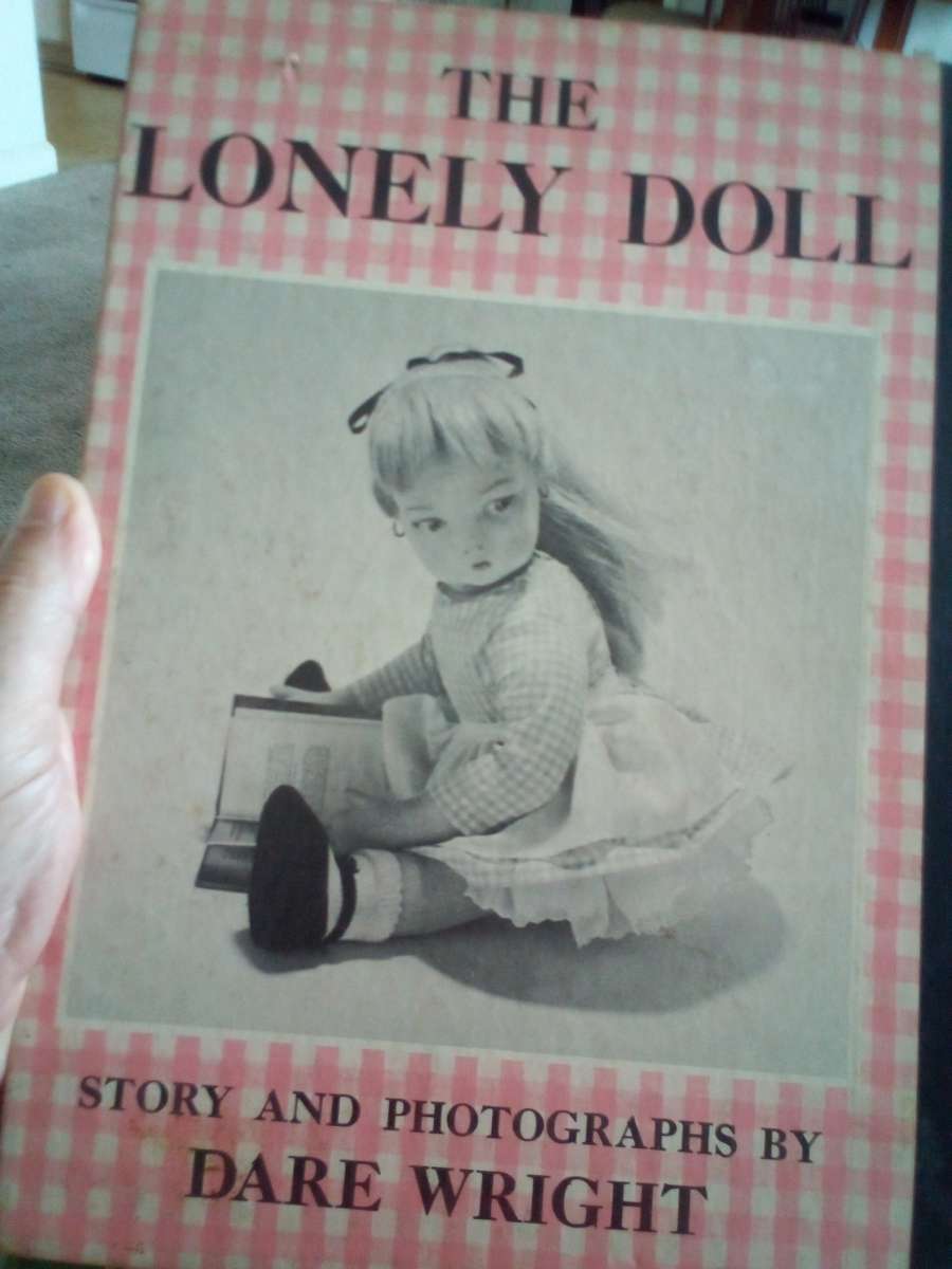 hard back book of the lonely doll story and photos by Dare w