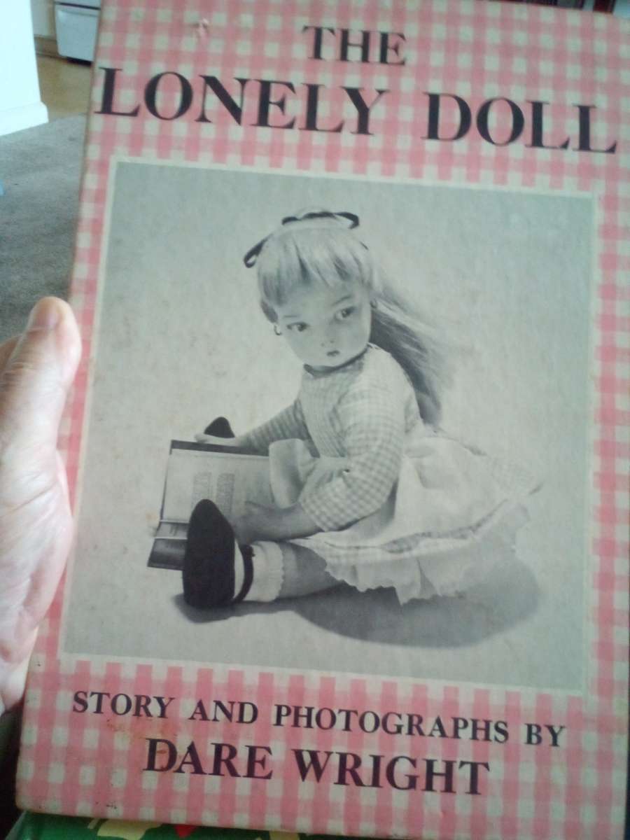 hard back book of the lonely doll story and photos by Dare w