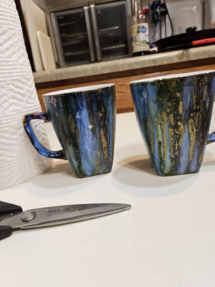 handpainted glass items and wood and stone sculptures