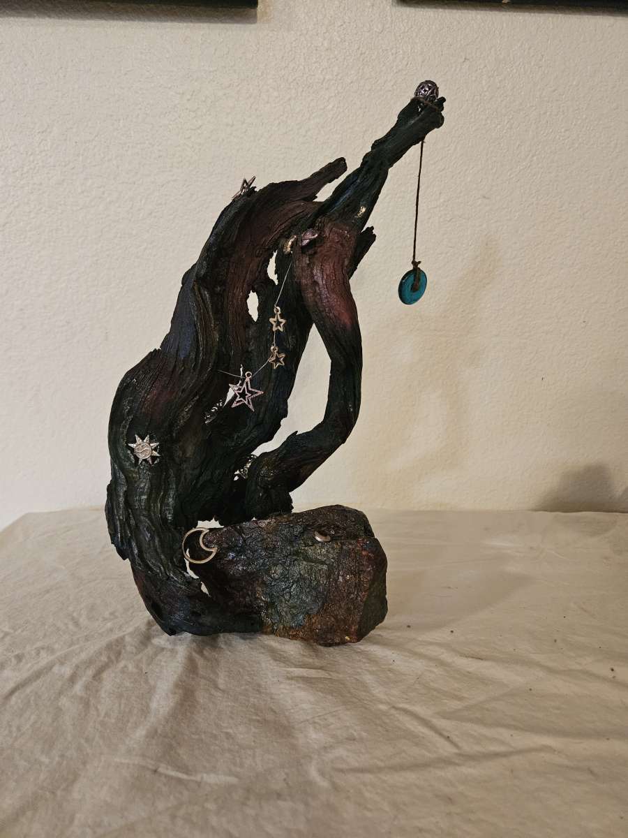 handpainted glass items and wood and stone sculptures