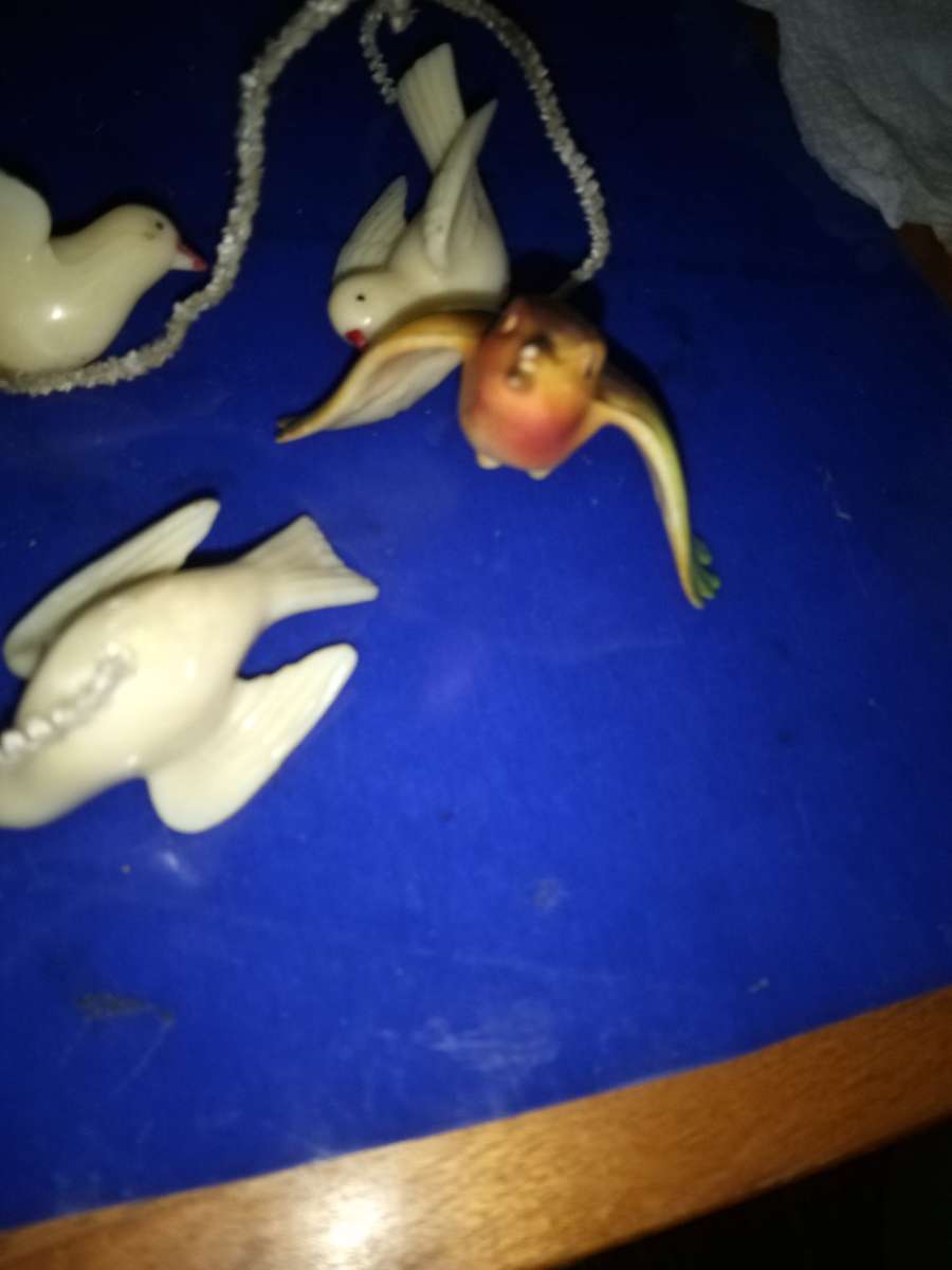 3 white and 1 airbrushed Lucite Birds