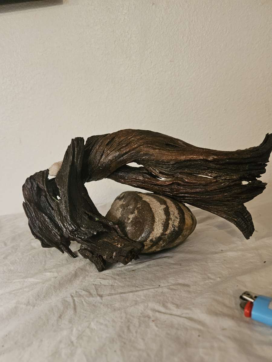 handpainted glass items and wood and stone sculptures